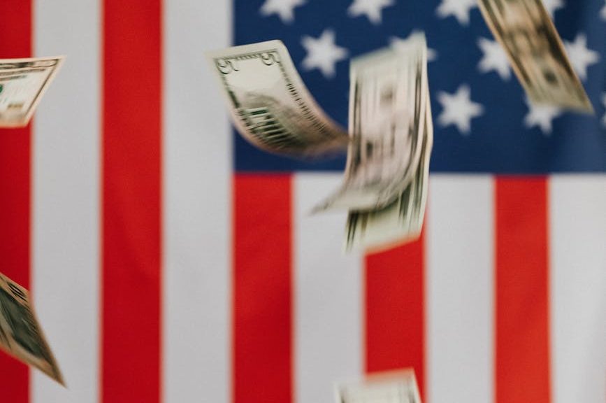 american flag and money falling down